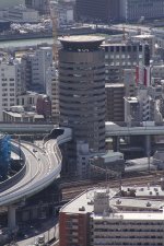 1200px-Building_penetrated_by_an_expressway_001_OSAKA_JPN.jpg